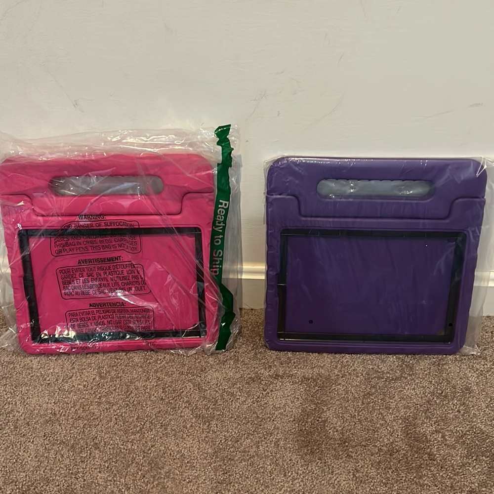 Two regular size iPad cases that have stand and are drop resistant